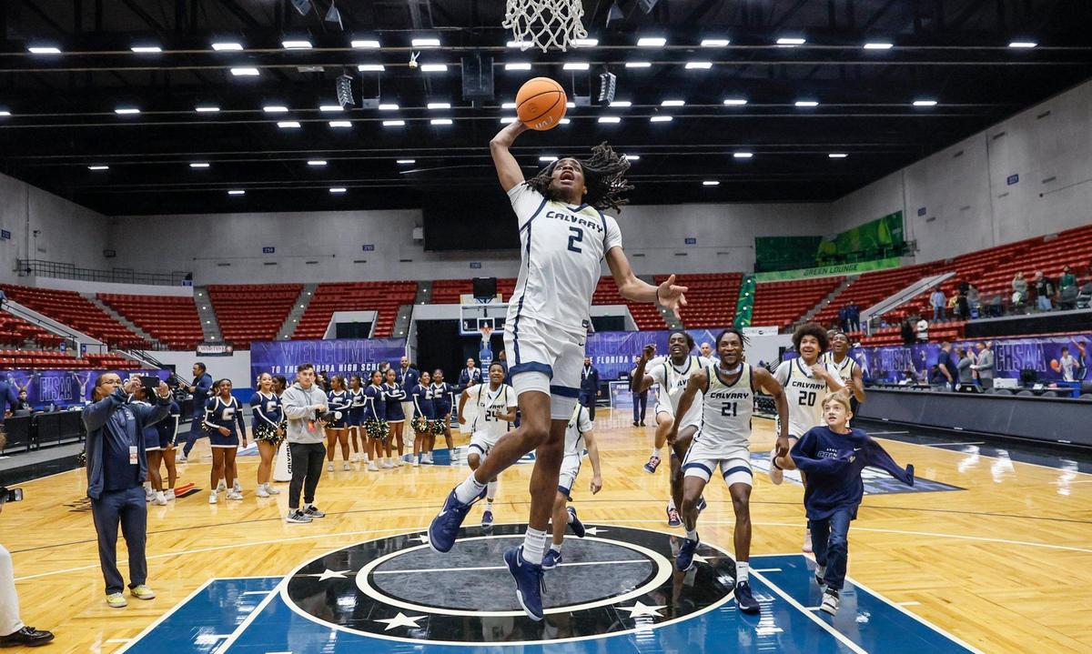 Calvary Christian’s Kenneth Francis Jr. (2) celebrates with teammates on the court after defeating the Villages for the FHSAA Class 3A Boys High School Basketball State Championship at the RP Funding Center in Lakeland, Florida on Saturday, March 1, 2025.