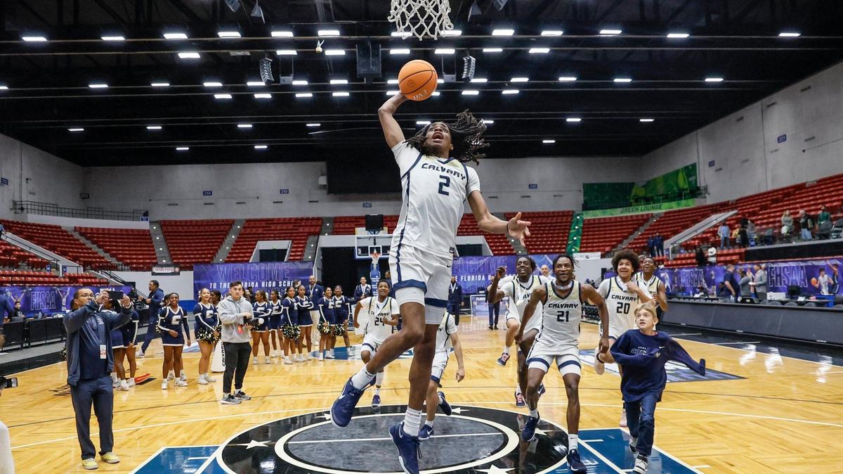 Calvary Christian’s Kenneth Francis Jr. (2) celebrates with teammates on the court after defeating the Villages for the FHSAA Class 3A Boys High School Basketball State Championship at the RP Funding Center in Lakeland, Florida on Saturday, March 1, 2025.
