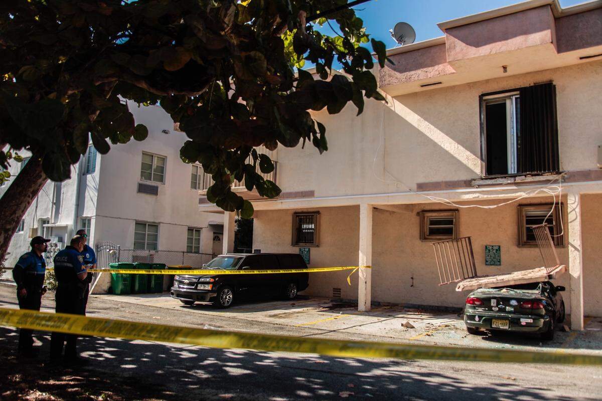 A second floor balcony fell from 8425 Harding Ave. in Miami Beach and onto the Chevrolet parked below.