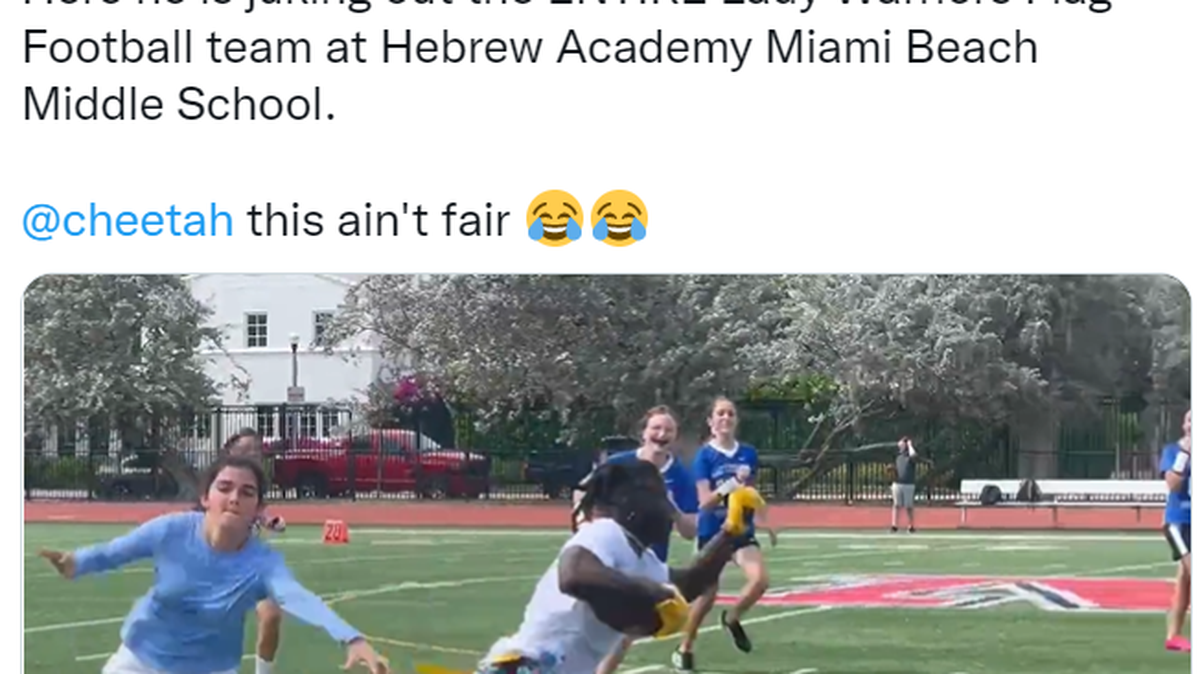 Dolphins wide receiver Tyreek Hill is seen in this screenshot running past the Hebrew Academy Middle School girls flag football team in Miami Beach.