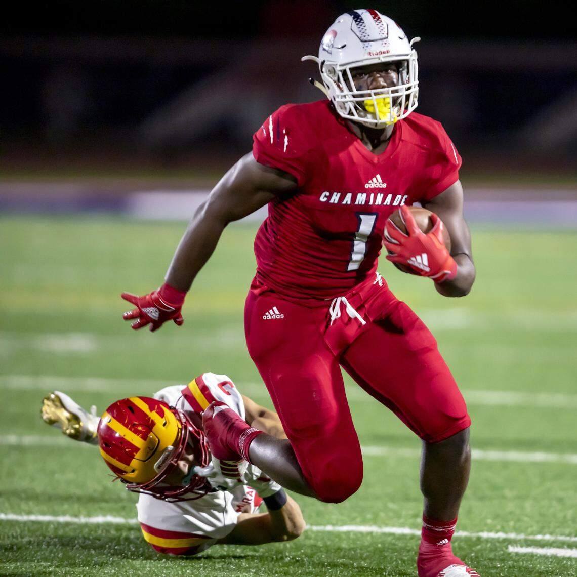 Chaminade-Madonna running back Thaddius Franklin (1) runs the ball during the first quarter of a football game against Clearwater Central on Nov. 29. Franklin is among 10 UM non-binding commitments for the 2021 class.