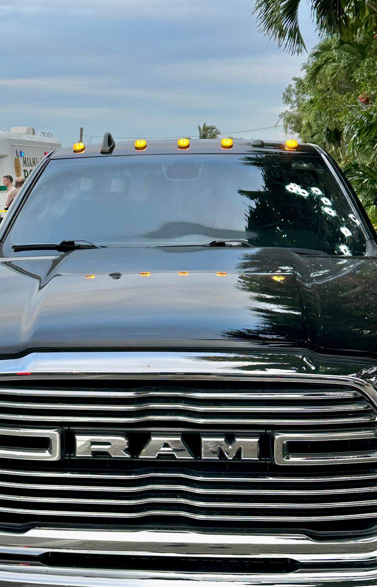An unmarked Miami-Dade County Police pickup truck’s windshield is shown with several bullet holes in its windshield Wednesday, Nov. 29, 2023. The truck was struck during a gun fight in the Redland.