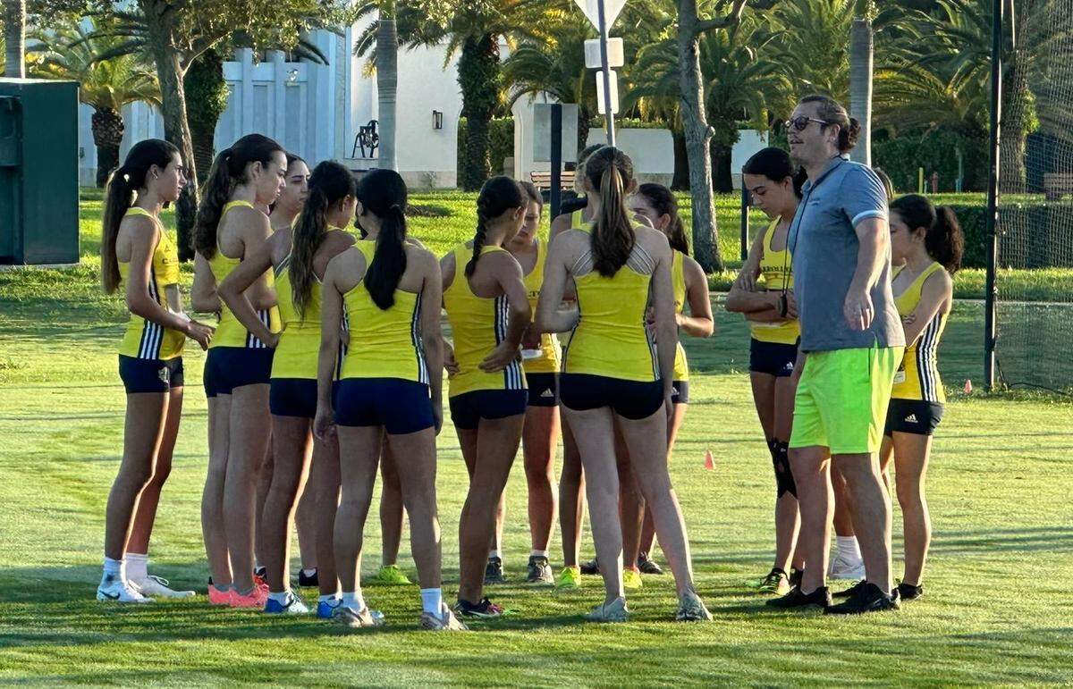 Carrollton cross-country coach Ross “Dylan” Hermelee talks to his team during a meet this season. Hermelee is the Miami Herald’s Girls’ Cross-country Coach of the Year.