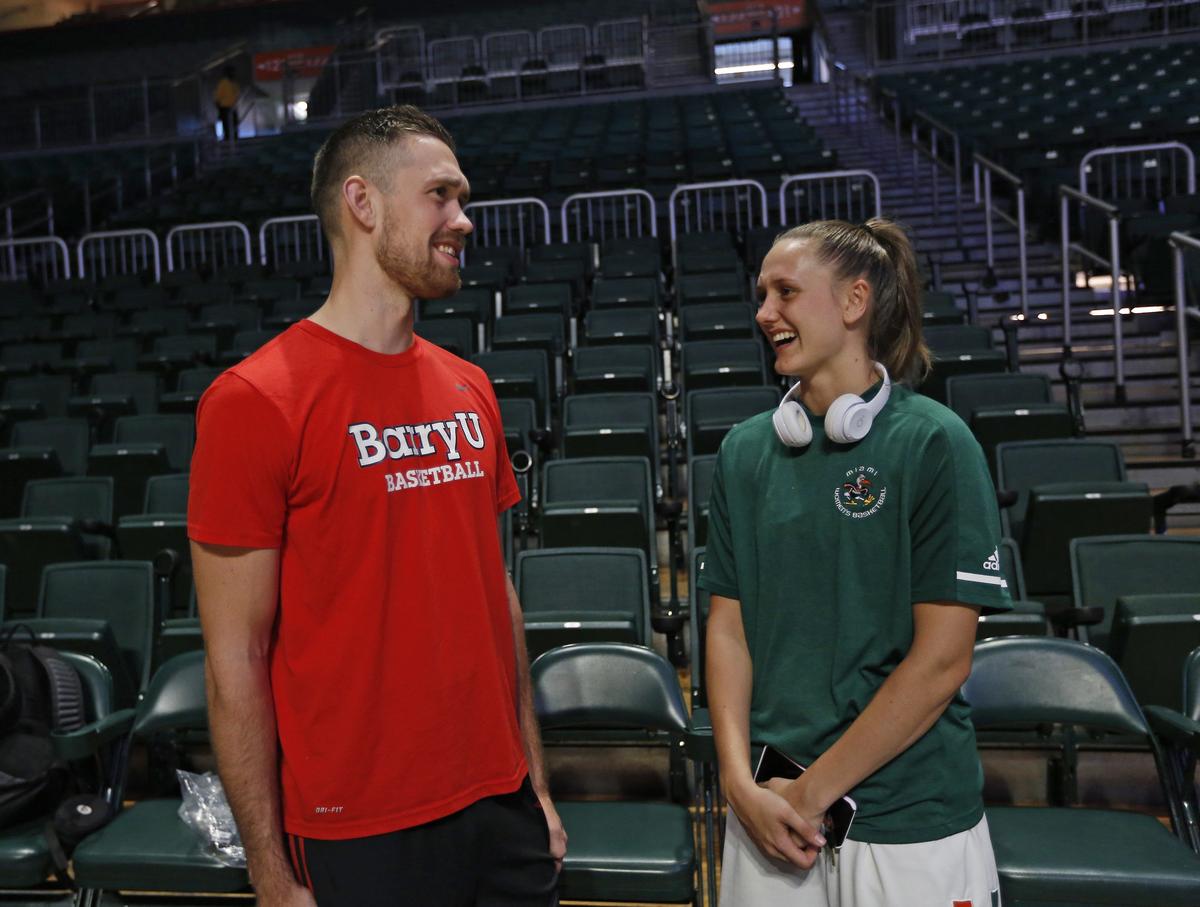 Barry University Buccaneers forward Daniel Mortensen talks with his sister, Miami Hurricanes guard Sarah Mortensen, before the start of a men’s NCAA college basketball exhibition game at the Watsco Center in Coral Gables on Tuesday, Oct. 30, 2018.