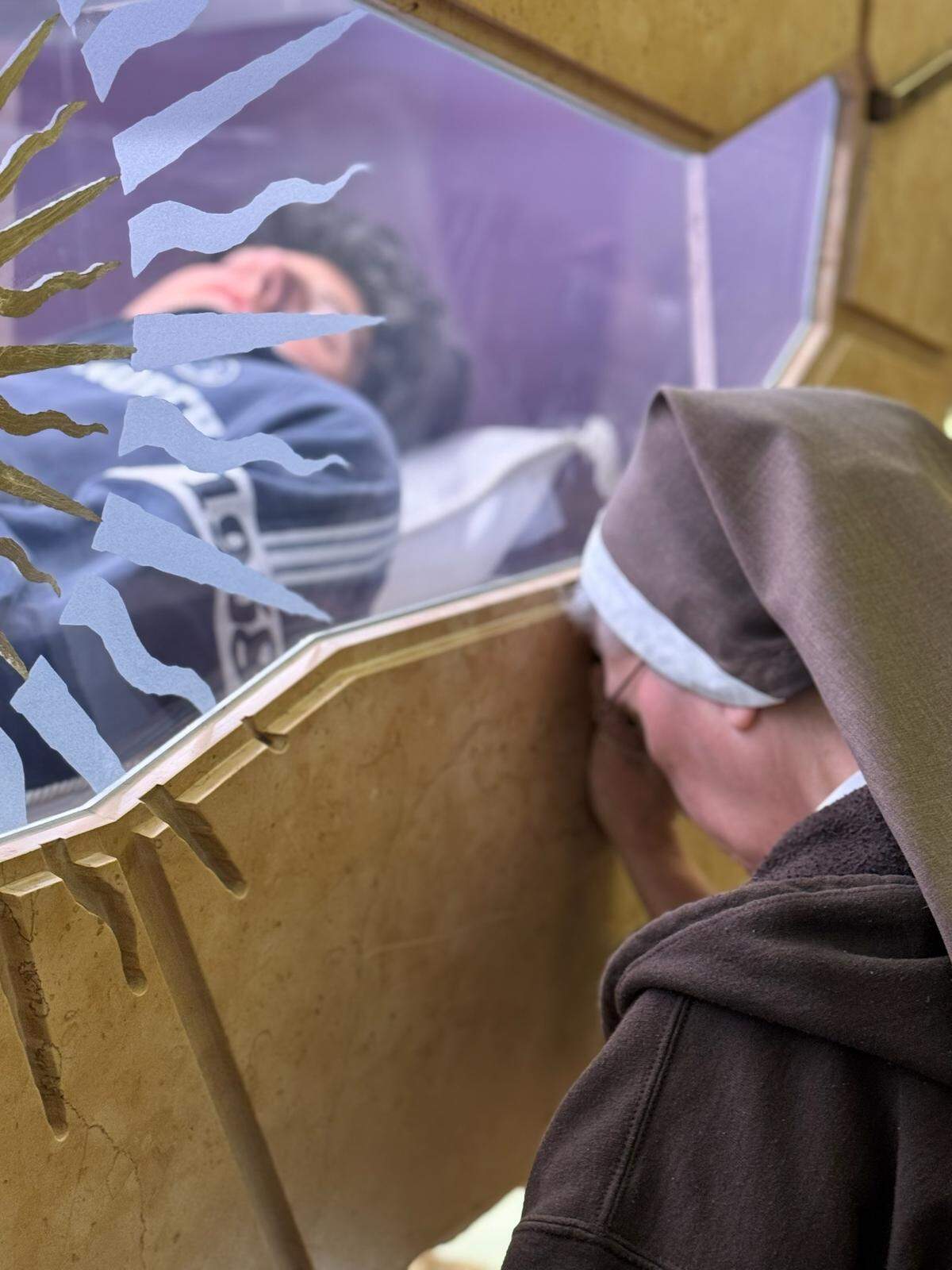 Mother Adela Galindo, founder and leader of the Servants of the Pierced Hearts of Jesus and Mary, prays in Assisi where Blessed Carlo Acutis remains lie. Acutis is going to be canonized as the first Millennial Catholic saint.