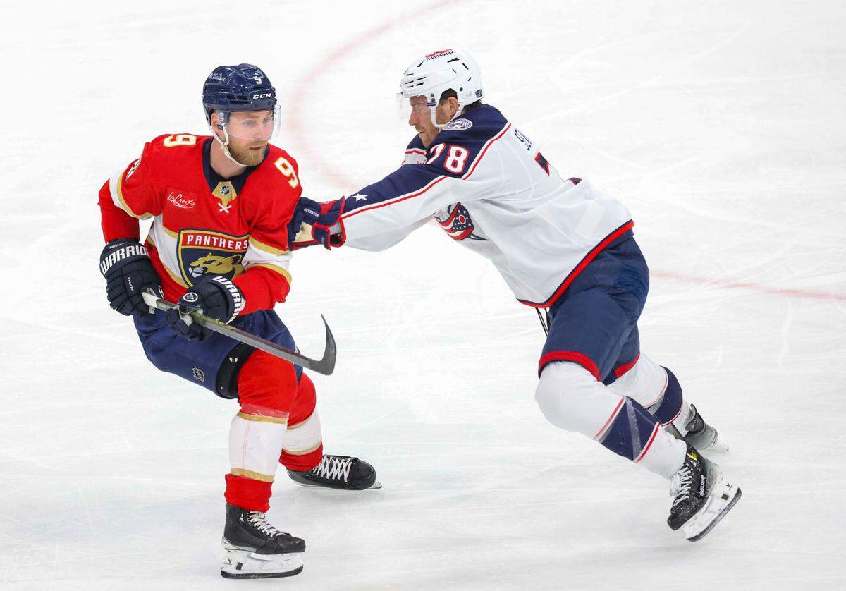 Columbus Blue Jackets defenseman Damon Severson (78) shoves Florida Panthers center Sam Bennett (9) during the second period of a game on Thursday, March 6, 2025, at Amerant Bank Arena in Sunrise, Fla.