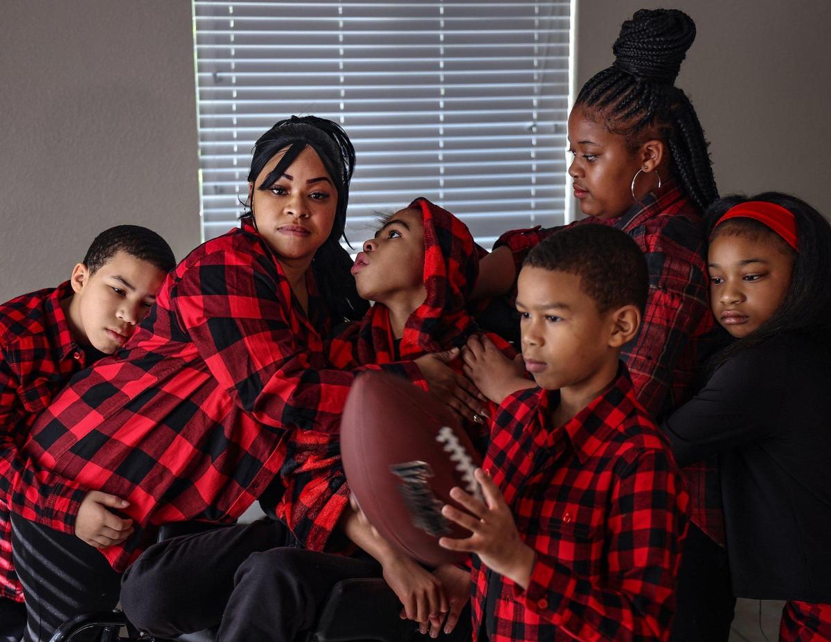 Kisha Smith, 38, is raising her six children and hopes to get a play area for her son Keshon Smith, who has a life altering disability. The Smith family in their Miami home, from left: Uwais Smith, 10, Kisha Smith, Keshon Smith, 15, Qais Smith, 9, America Smith, 12, and Najmah Smith, 8.