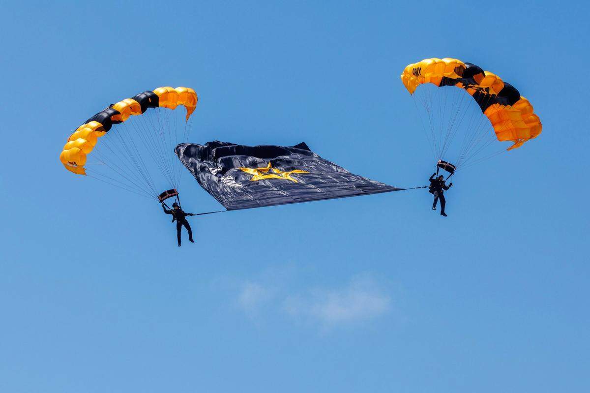 Members of the U.S. Army Golden Knights prepare to land on South Beach during the Hyundai Air & Sea Show, part of Miami Beach’s annual National Salute to America’s Heroes, on Saturday, May 24, 2025.