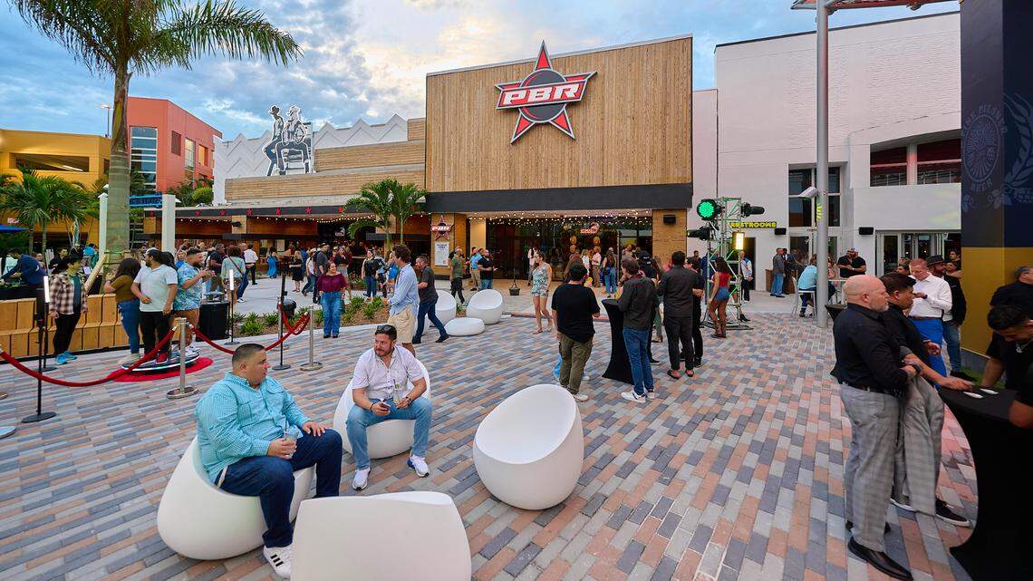 Guests relax in the outdoor courtyard of the new Vivo! entertainment complex at the Dolphin Mall.