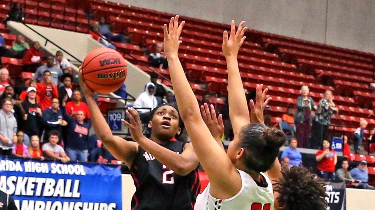 Back in Northeast high school Cabria Lee (2) shoots against Fort Walton. Last season at FIU, Lee started three games and averaged 2.3 points.