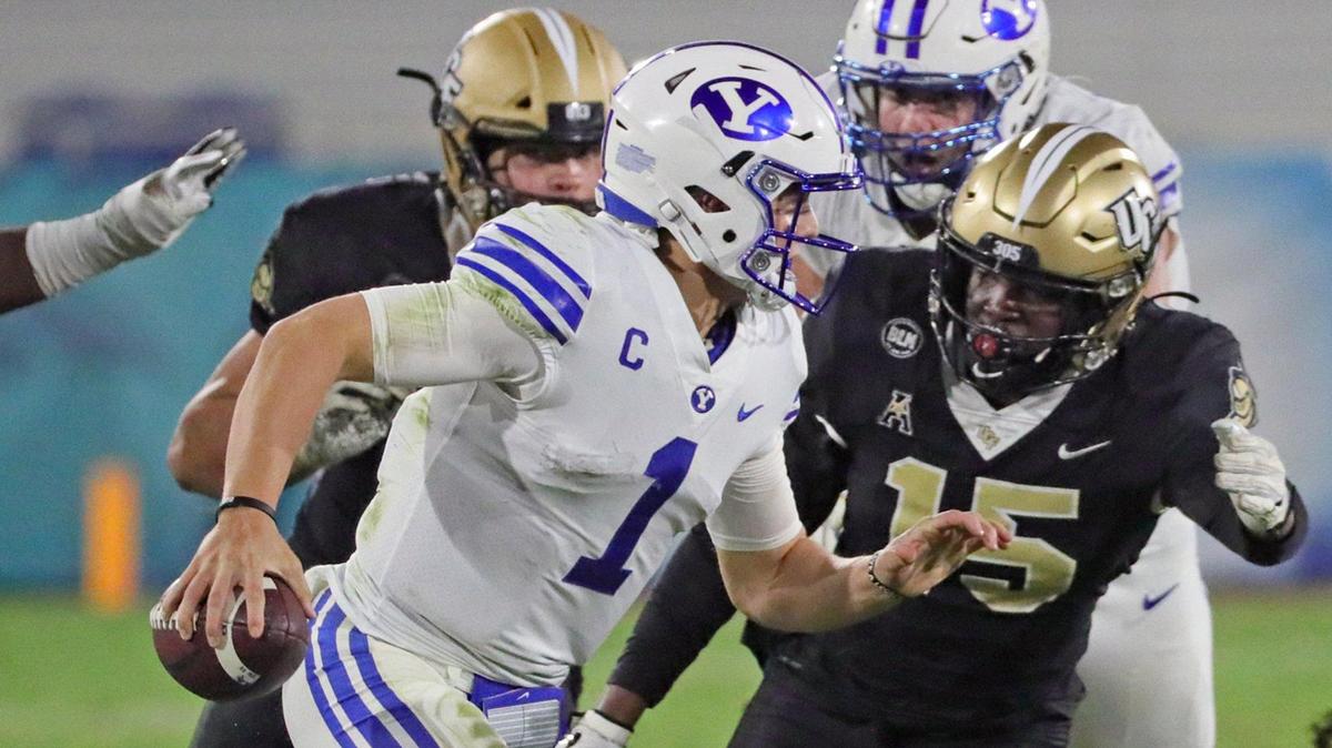 UCF Knights linebacker Tatum Bethune (15) chases Brigham Young Cougars quarterback Zach Wilson (1) in the fourth quarter in the Boca Raton Bowl 2020 at FAU Stadium in Boca Raton on Tuesday, December 22, 2020.