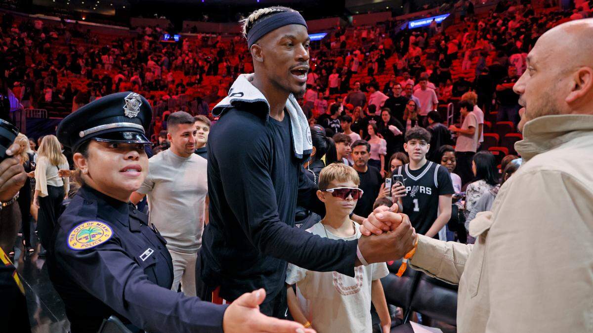 Miami Heat forward Jimmy Butler (22) meets with fans at court-side after the NBA basketball game against the San Antonio Spurs at Kaseya Center on January 19, 2025.