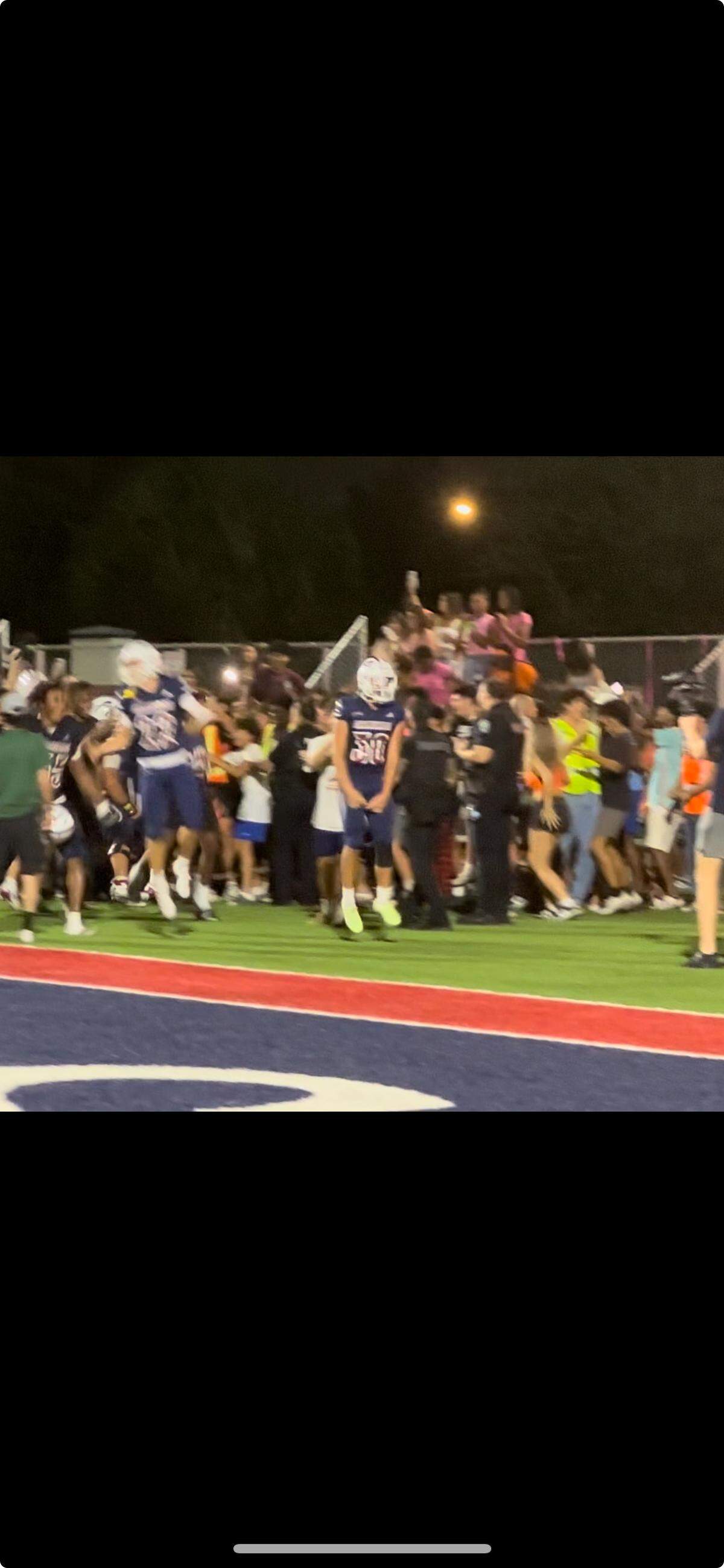 Chaminade kicker Noah Sidan celebrates with teammates and fans after making his 25-yard game-winning field goal on Friday night against American Heritage at Hollywood, Fla.