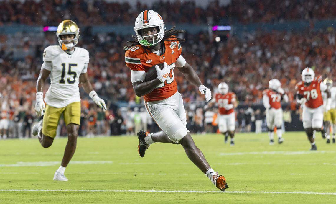 Miami Hurricanes wide receiver Malachi Toney (10) scores a touchdown against the Notre Dame Fighting Irish in the first half of their NCAA football game at Hard Rock Stadium on Sunday, Aug. 31, 2025, in Miami Gardens, Fla.