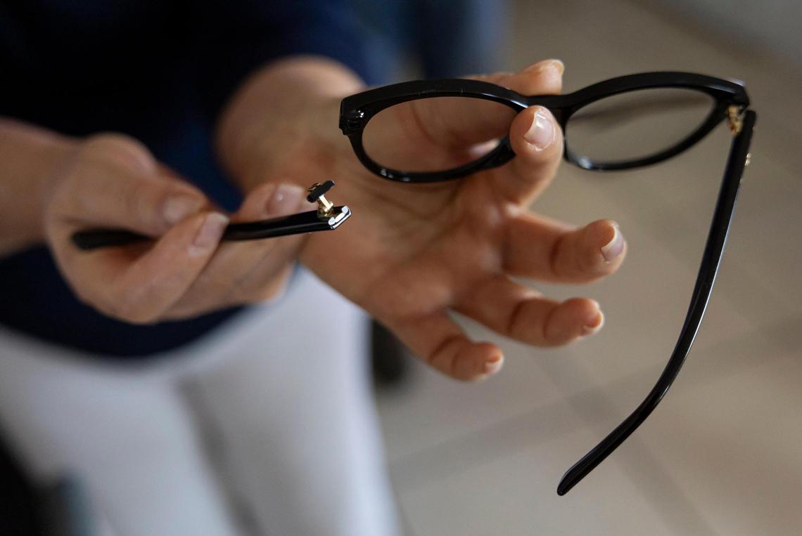 Vivian Hernandez, 61, shows her broken glasses at her home in the Li’l Abner Mobile Home Park on Saturday, Dec. 21, 2024, in Sweetwater, Florida. Police said Hernandez was arrested after refusing to leave the park’s management office following a dispute with employees.