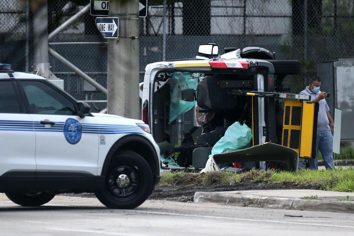 Miami police respond to a two-vehicle crash at Northwest Third Court and Sixth Street where a wheelchair-bound woman was trapped in a van on Friday, July 17, 2020.