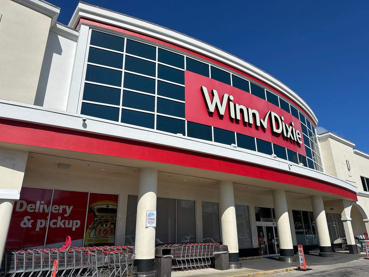 The Winn-Dixie storefront on Coral Way at 3275 SW 22nd Ave. The 57,124 square foot supermarket has a liquor store component and was built in 1990. The ground once was the site of the Twin Gables and later Triple Gables movie theater from 1970 to the late 1980s.