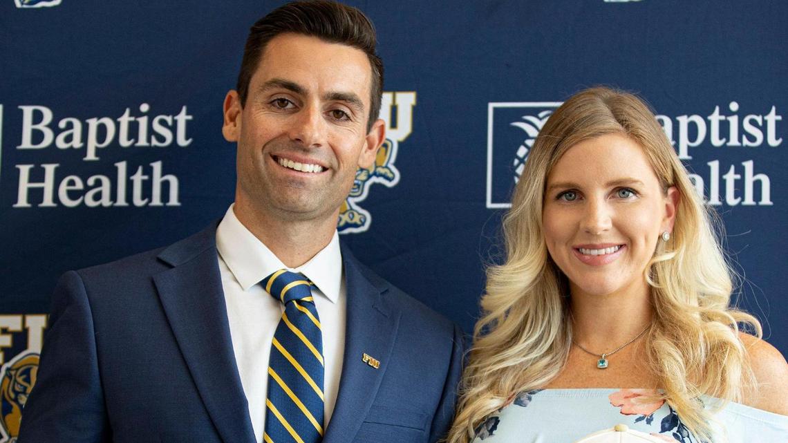 Newly appointed FIU Baseball Coach Rich Witten (left) poses with his wife Natalie Kalibat Witten on Monday, June 27, 2022 at the FIU Baseball Stadium in Miami, Fla.