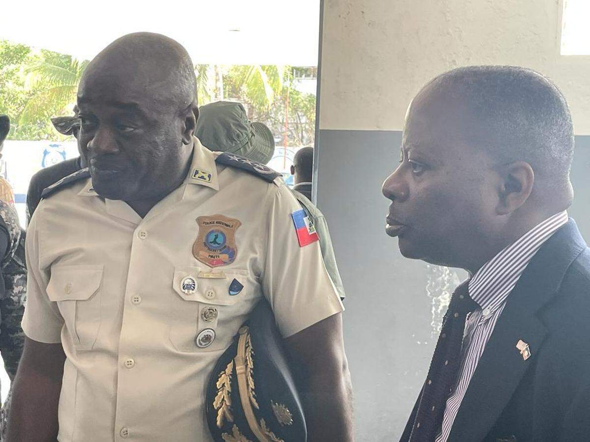 Haiti National Police Director General Frantz Elbé, left, talks with Todd Robinson, assistant secretary of state in charge of the Bureau of International Narcotics and Law Enforcement Affairs in the Biden administration, during a January 2023 visit to Port-au-Prince.