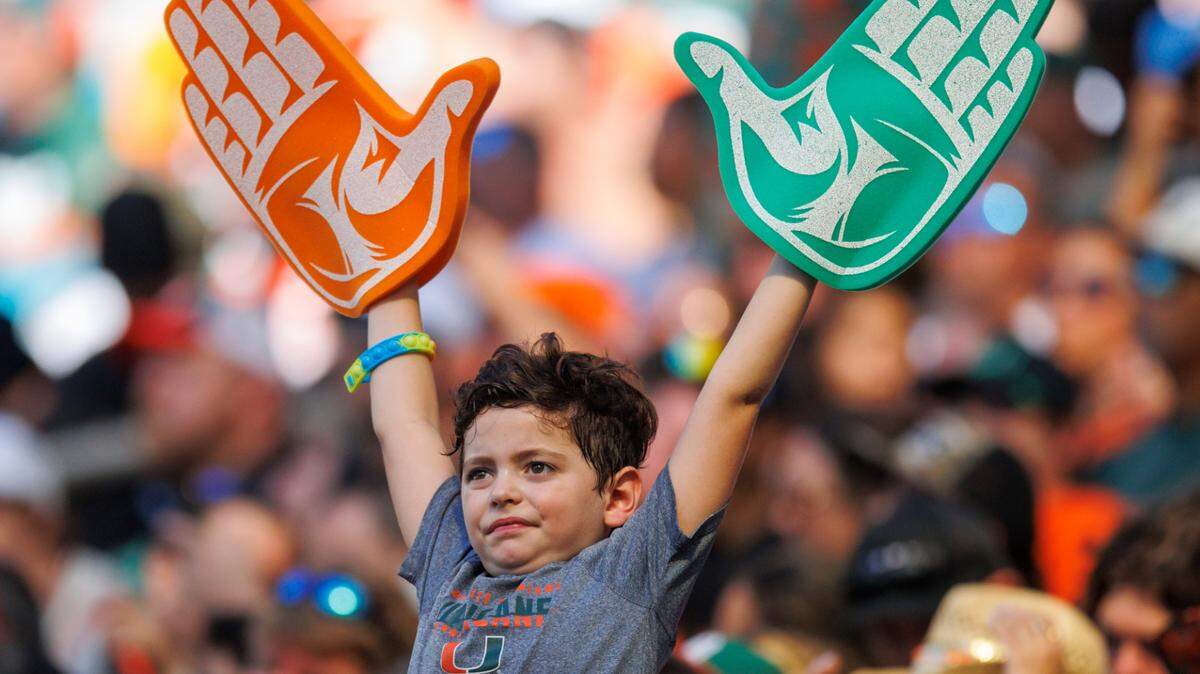 A young Miami Hurricanes fan shows his support during the second quarter of an ACC football game against Bethune-Cookman Wildcats at Hard Rock Stadium on Saturday, September 3, 2022 in Miami Gardens, Florida.