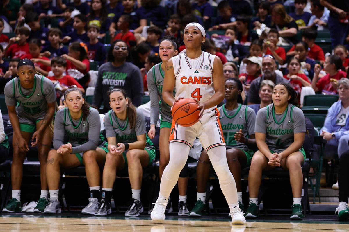 Miami Hurricanes guard Jasmyne Roberts (4) shoots the basketball against the Stetson Hatters during the second quarter at the Watsco Center in Coral Gables, Florida, Monday, November 4, 2024.