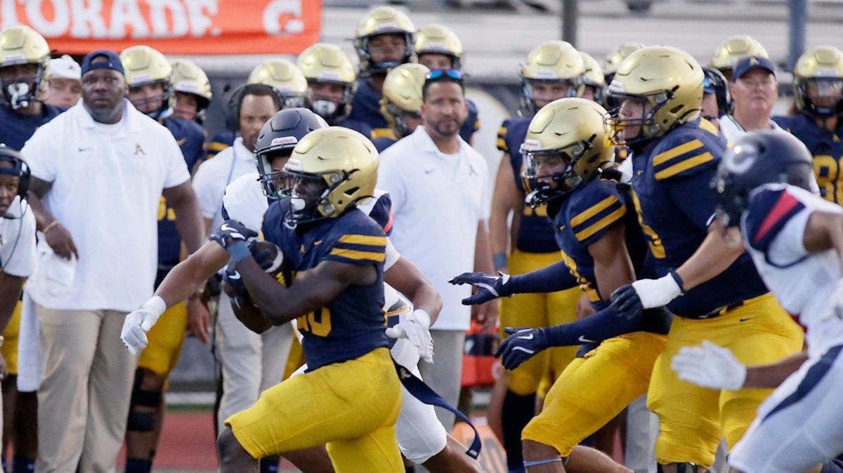St. Thomas Aquinas Raiders running back Virgil Lemons (28) runs the ball against Columbus Explorers during football game on Friday, September 6, 2024 at St. Thomas Aquinas HS in Fort Lauderdale.