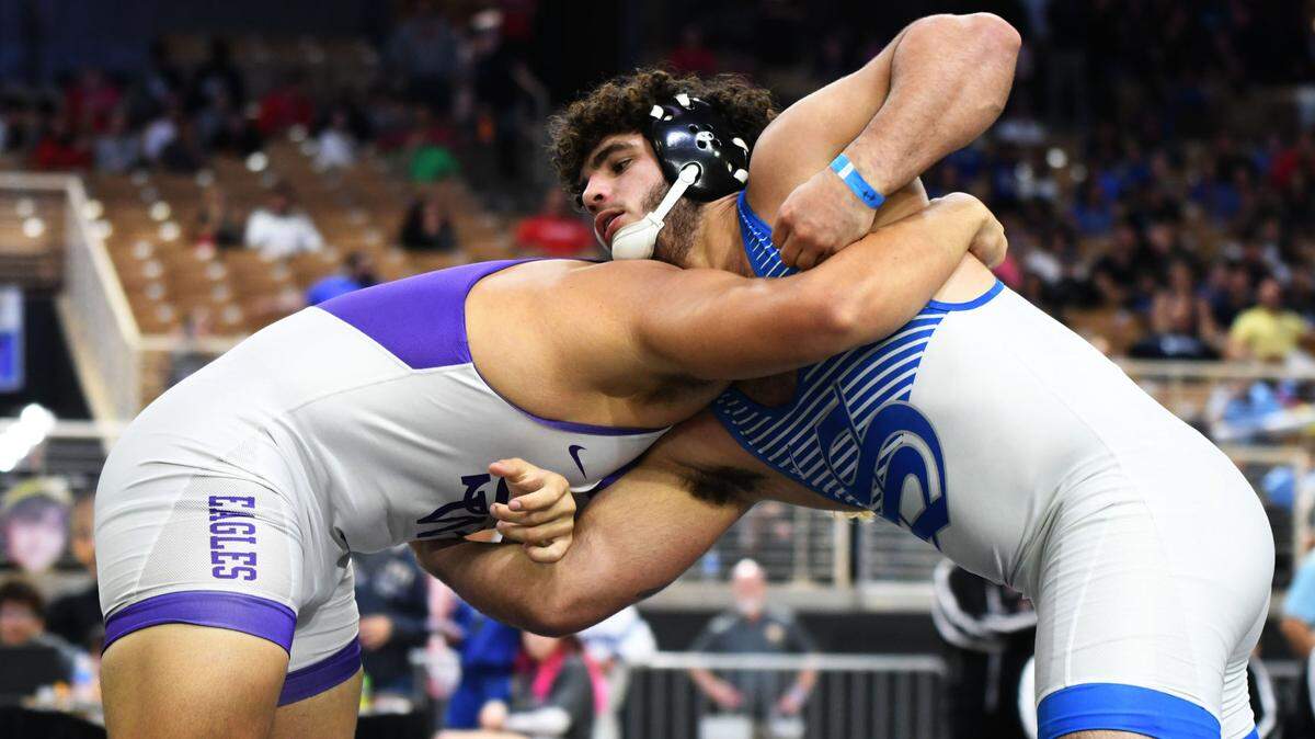 South Dade junior Sawyer Bartelt prepares to pin Southwest Miami’s Jonathan Fraga during the Class 3A 220-pound state title match on Saturday at Silver Spurs Arena in Kissimmee.