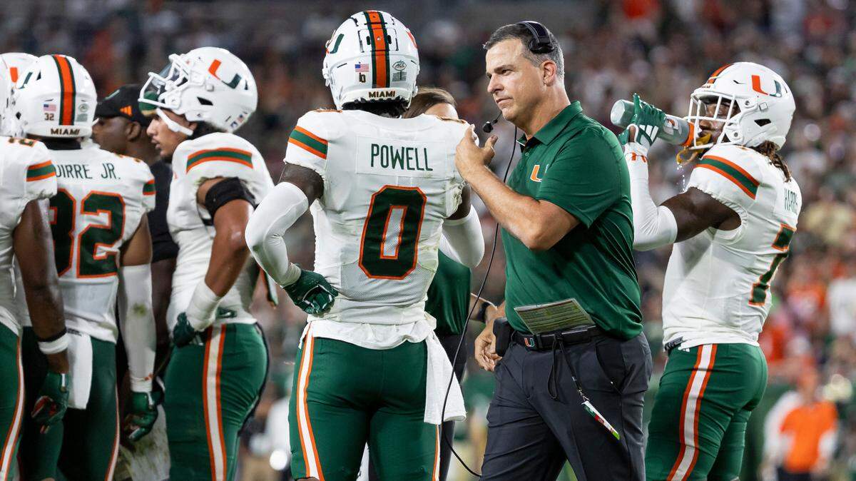 Miami Hurricanes head coach Mario Cristobal is seen on the field during a timeout in the first half of his NCAA college football game against the Miami Hurricanes at the Raymond James Stadium on Saturday, Sept. 21, 2024, in Tampa, Fla.