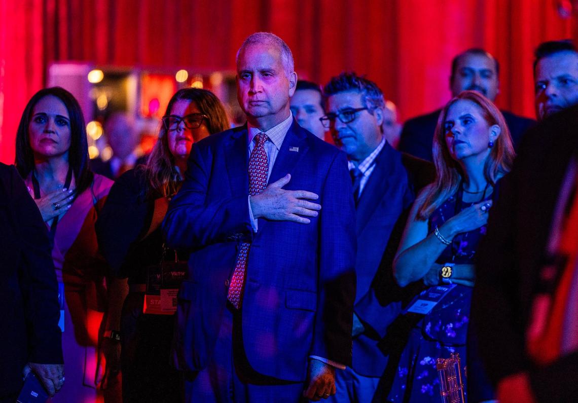 Florida Congressman Mario Diaz-Balart stands up during the pledge of allegiance at the Republican Party of Florida’s 2024 Victory Dinner, at the Seminole Hard Rock Hotel & Casino in Hollywood, Florida on Saturday, September 07, 2024.