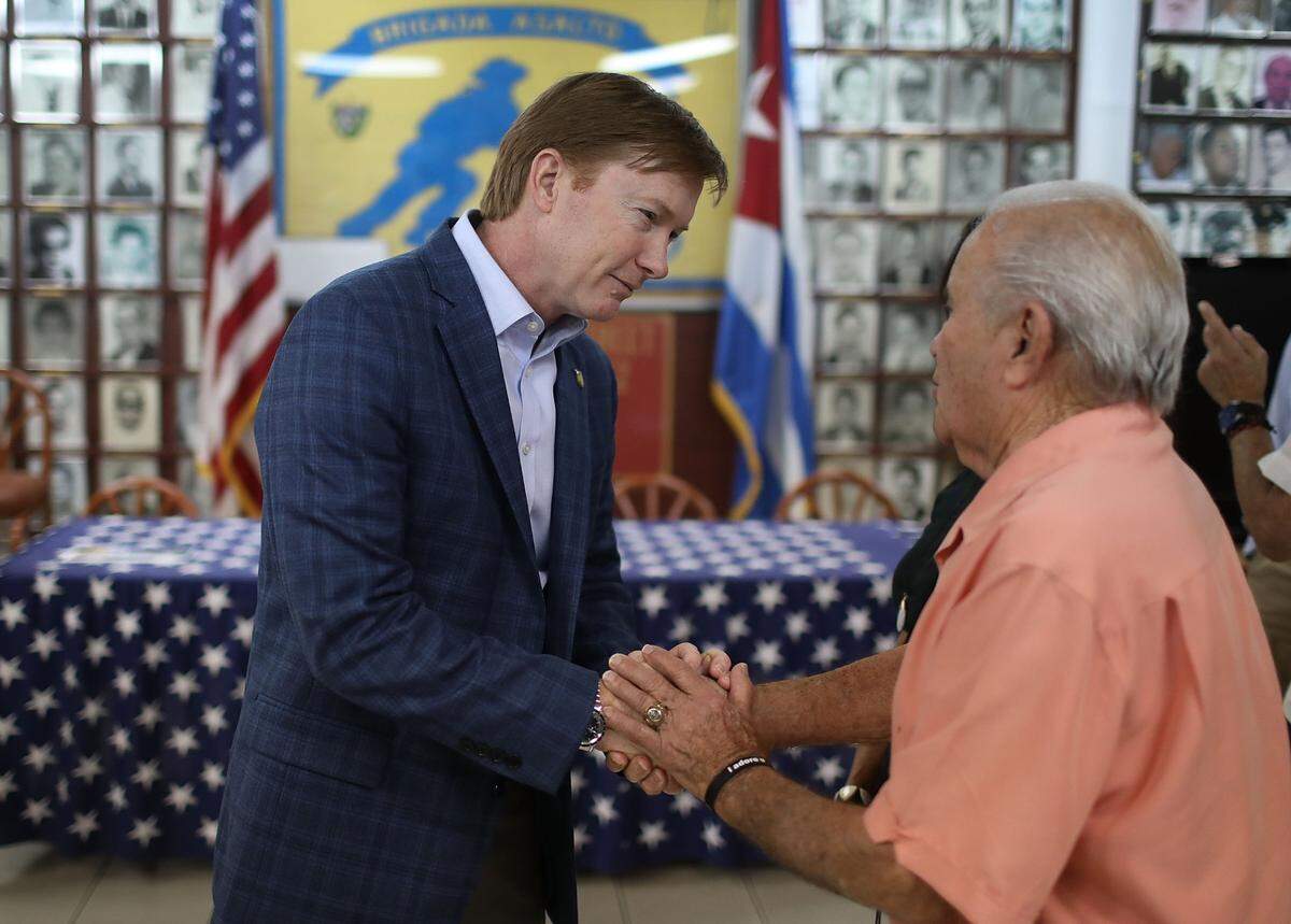 Adam Putnam greets Osvaldo Castellanos during a campaign event on Aug. 2, 2018, at the Bay of Pigs Veterans Association Museum in Miami as he runs to be the Republican nominee in the race to be the next governor of Florida.