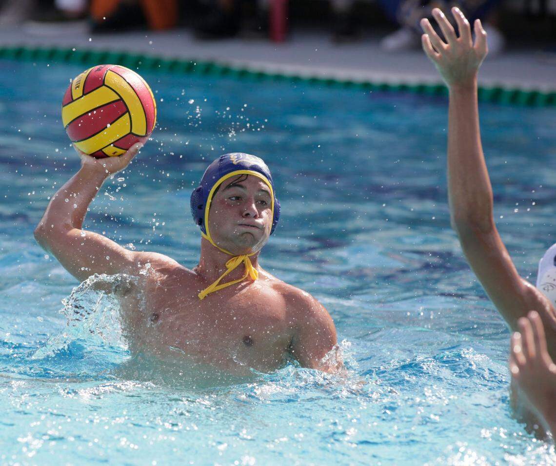 Belen Jesuit’s Carlos Veccio throws the ball against Orlando’s Dr. Phillips during the State Water Polo Boys final game on Saturday, April 23, 2022 in Miami. Andrew Uloza / for THE MIAMI HERALD