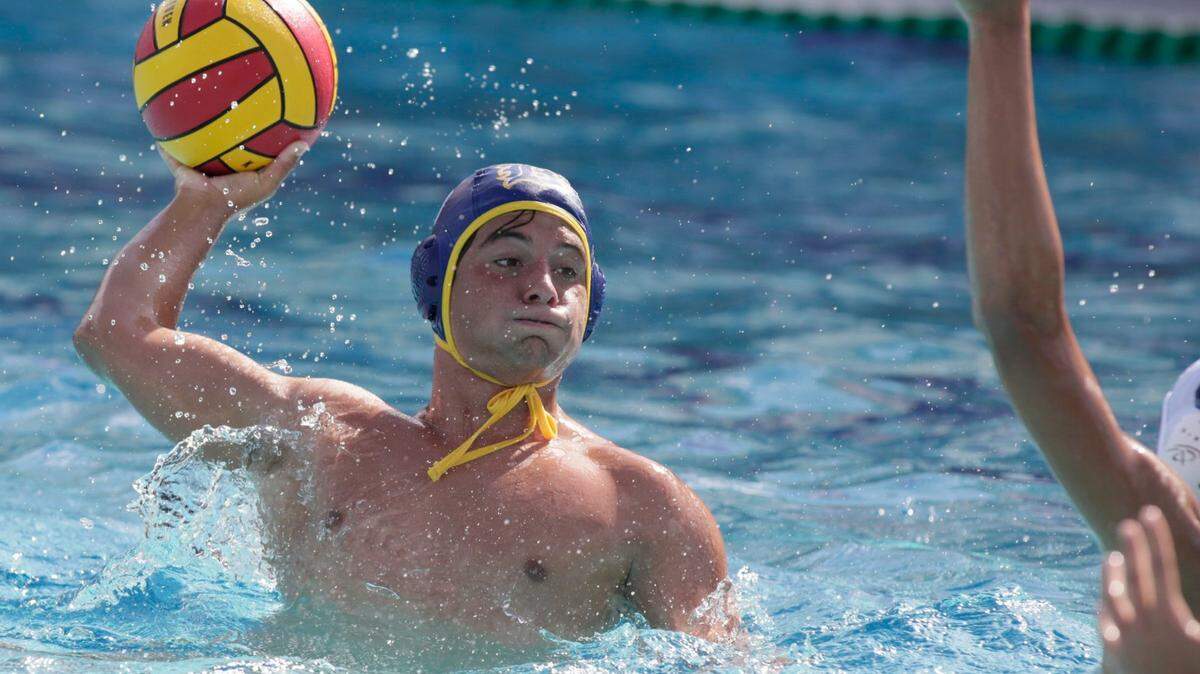 Belen Jesuit’s Carlos Veccio throws the ball against Orlando’s Dr. Phillips during the State Water Polo Boys final game on Saturday, April 23, 2022 in Miami. Veccio scored nine goals. Andrew Uloza / for THE MIAMI HERALD