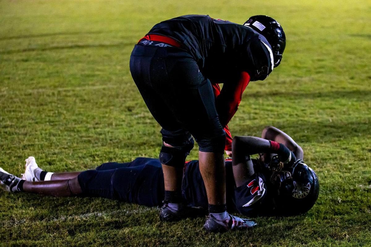 Miami Southridge players react to losing to Doral Academy during double overtime of an high school football game at South Ridge Park in Miami, Florida, on Friday, September 24, 2022.