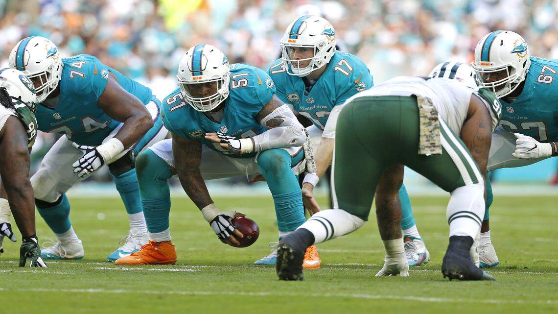 Miami Dolphins center Mike Pouncey (51) snaps to Miami Dolphins quarterback Ryan Tannehill (17) in the third quarter against the New York Jets at Hard Rock Stadium on Sunday, Nov. 6, 2016.
