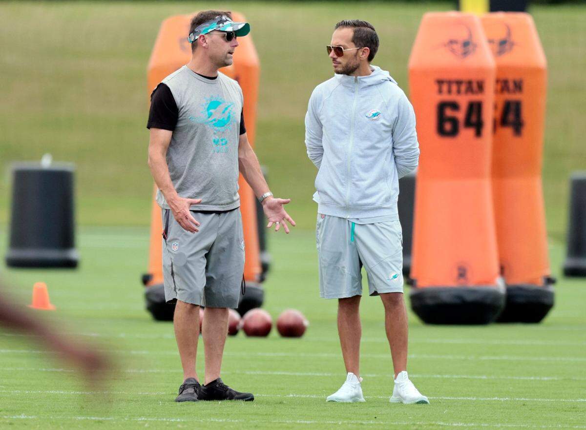 Miami Dolphins head coach Mike McDaniel, at right, speaks with Defensive Coordinator Josh Boyer practice at Baptist Health Training Complex in Miami Gardens on Wednesday, September 21, 2022.