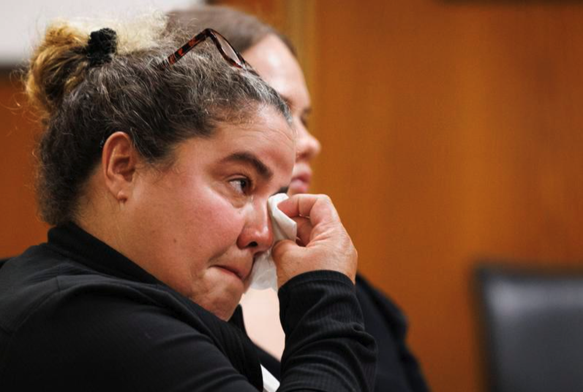 Gamaly Hollis wipes away a tear during a court hearing following her release from jail.