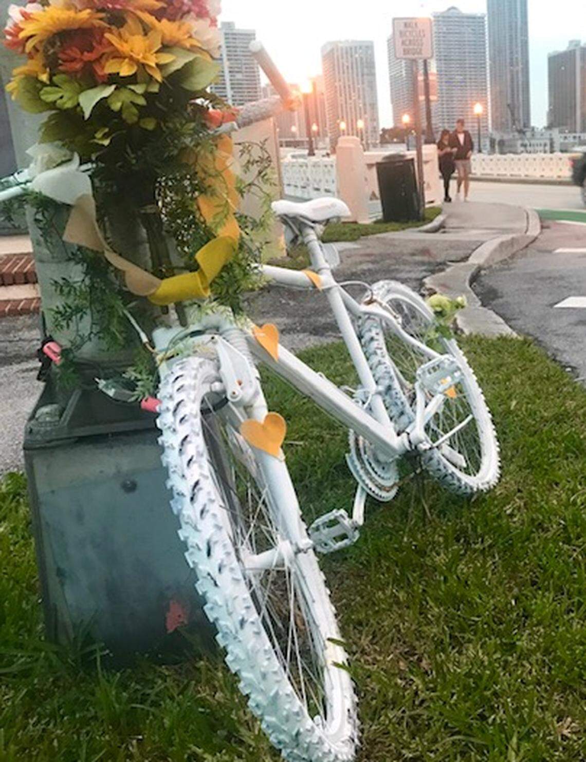 A “ghost bike” memorial in honor of Flavia Carnicelli has been placed beside the Venetian Causeway, near the spot where she was killed by a motorist last year.