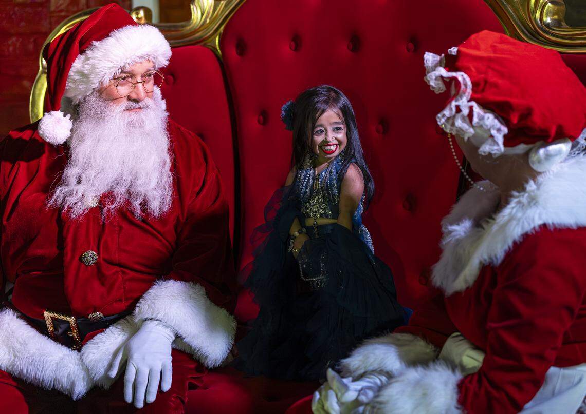 Jyoti Amge, an Indian actress and Guinness World Record holder for being the world's shortest living woman, talks with Santa Claus and Mrs. Claus during the grand opening of Ripley's Believe It or Not! Christmas Park at Amelia Earhart Park on Thursday, Nov. 13, 2025, in Hialeah, Fla.