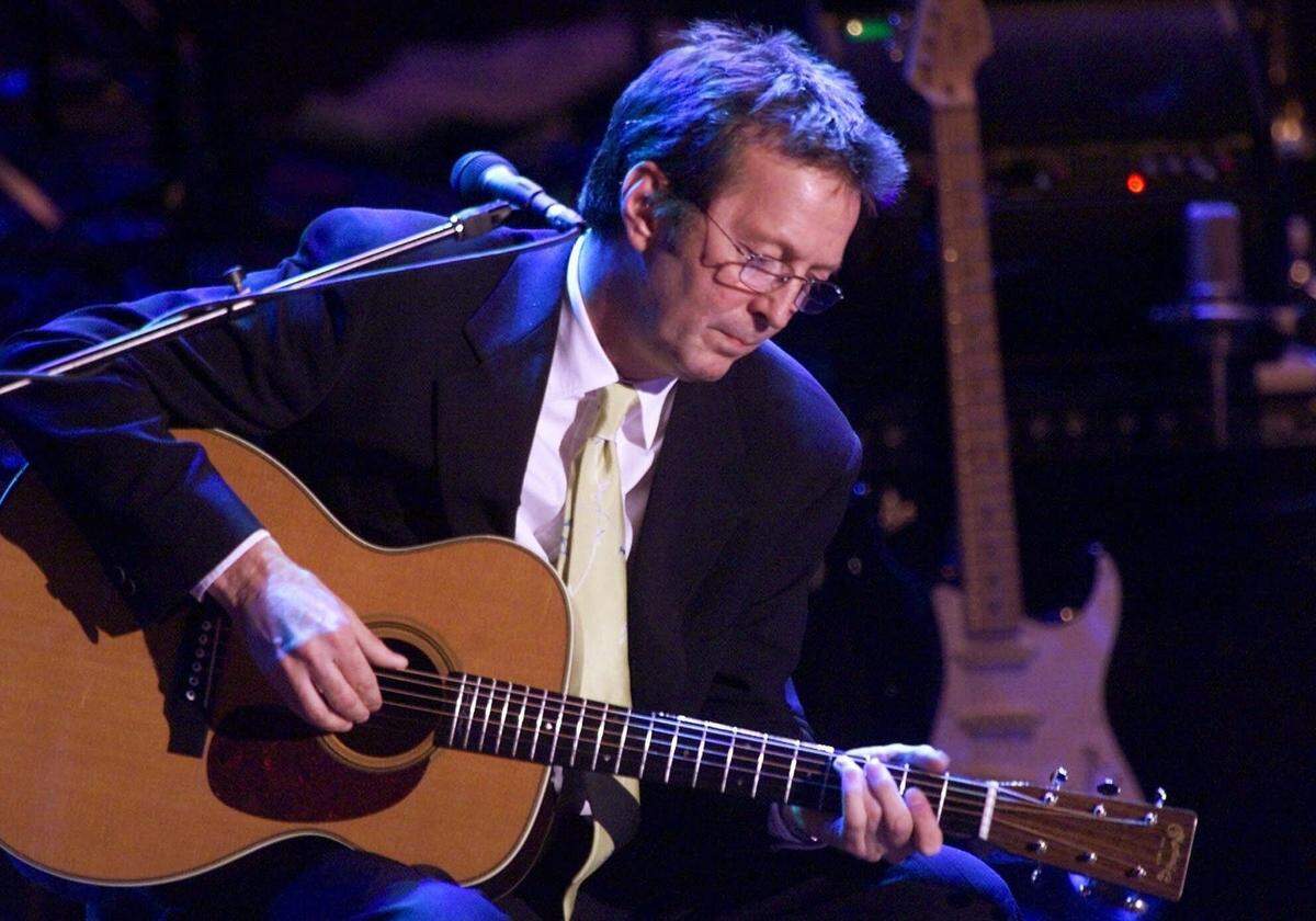 Guitarist Eric Clapton performed at the 15th Annual Rock and Roll Hall of Fame Induction Dinner in New York in this March 6, 2000 file photo. He performed at the former Miami Arena in May 1992.