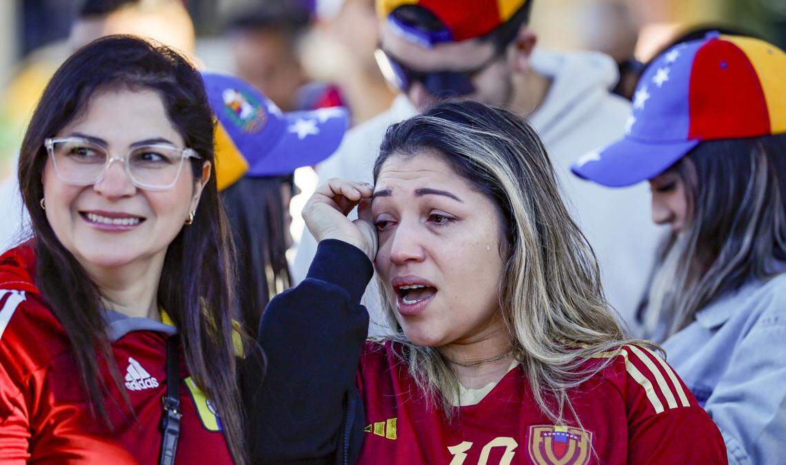 Laura Parra and Ana Karina Gonzalez react outside of El Arepazo in Doral, Florida, after the United States attacked Venezuela and captured Venezuelan leader Nicolás Maduro, on Saturday, January 3, 2026.