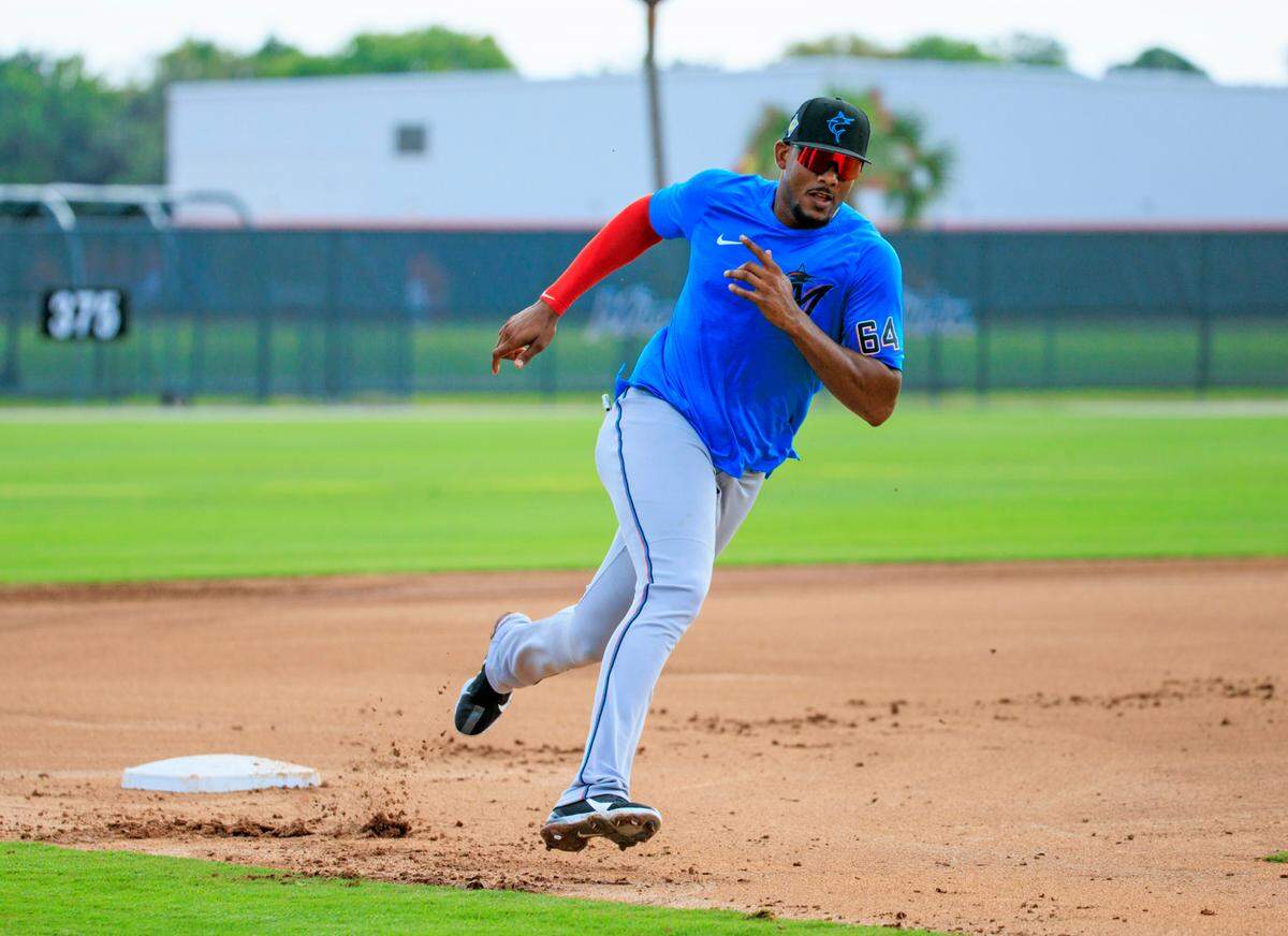 Miami Marlins outfielder Jerar Encarnacion runs drills during their spring training workout at Roger Dean Stadium on Thursday, March 17, 2022 in Jupiter, FL.