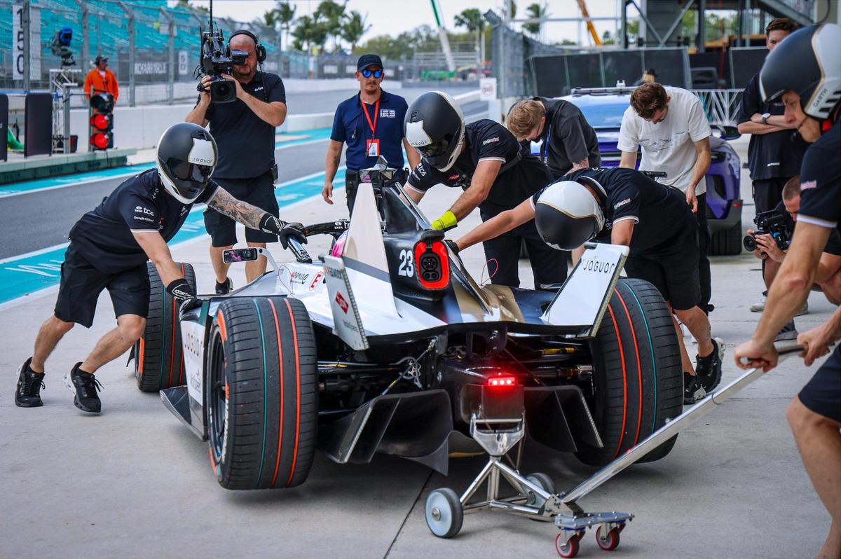 Members of team Jaguar push the team’s electric race car back into its garage after a test drive on Wednesday, March 6, 2025.