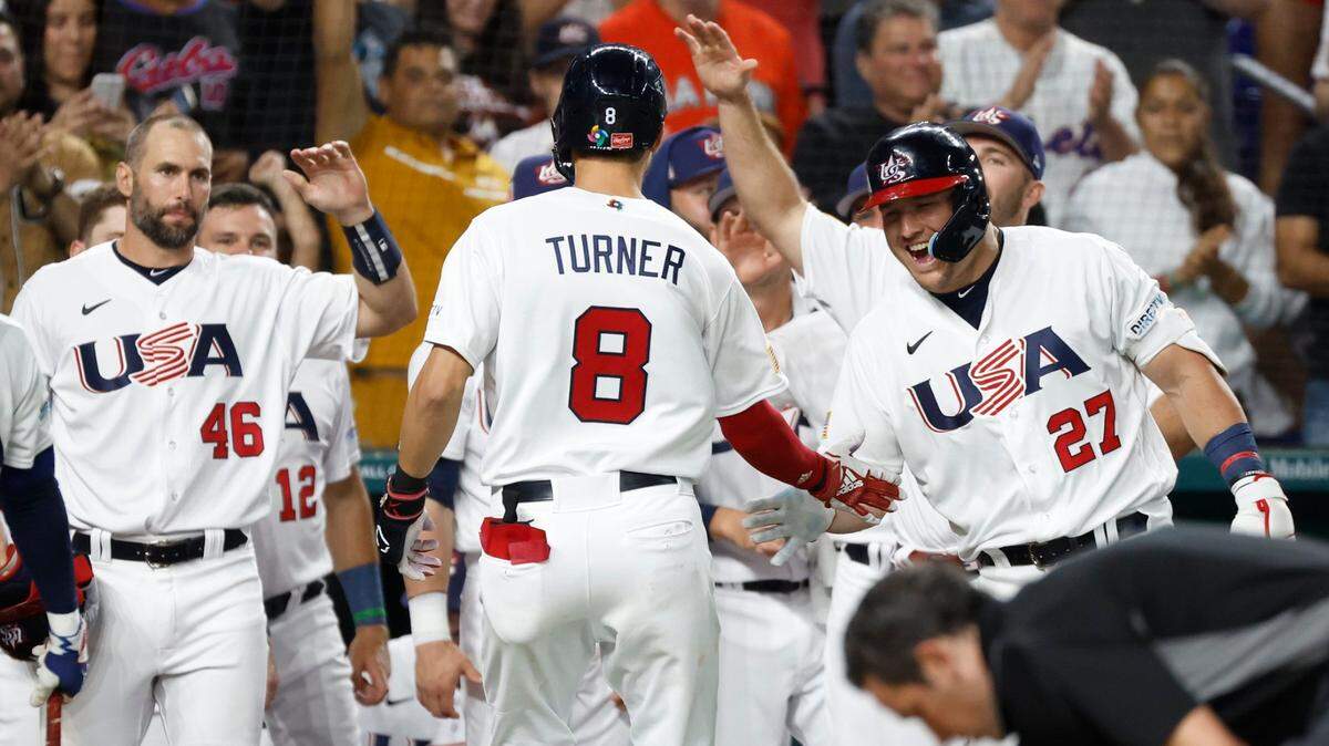 USA infielder Trea Turner (8) celebrates with teammates after a fly ball homer to left field in the second inning during the World Baseball Classic semifinal at loanDepot Park in Miami, Fla. on Sunday, March 19, 2023.