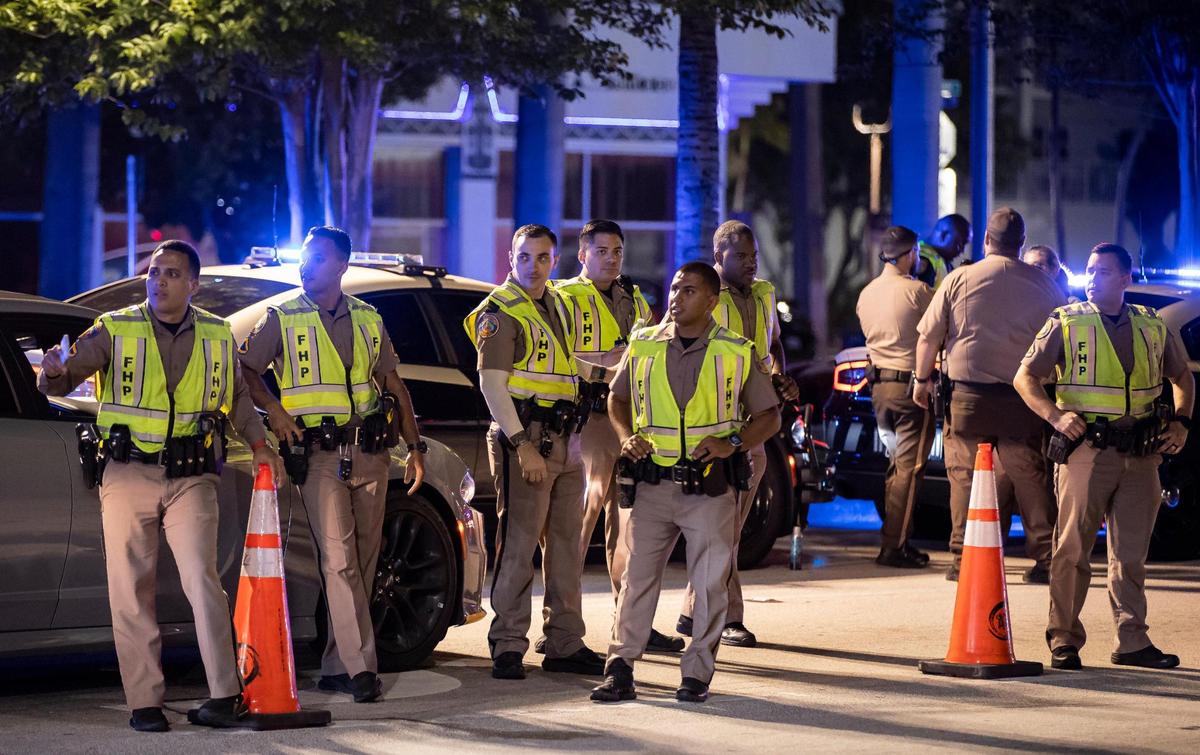 Florida Highway Patrol officers are stationed along Fifth Street on March 24, 2023, in Miami Beach.