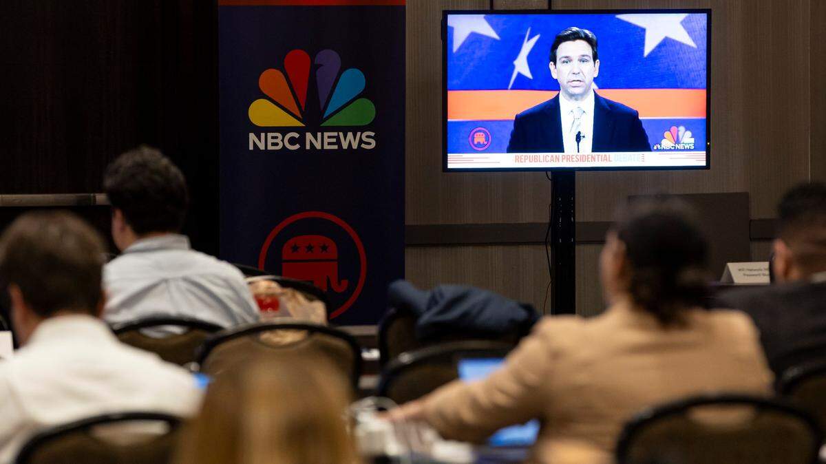 Journalists watch Florida Gov. Ron DeSantis speak during the third Republican presidential primary debate from a press room at the Miami Marriott Biscayne Bay hotel on Wednesday, Nov. 8, 2023, in downtown Miami, Fla.