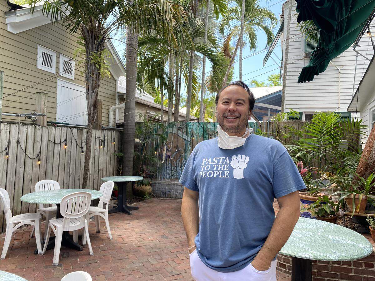 Michael Barnes, who owns Mangia Mangia restaurant with his wife Heather Barnes, waits for customers on May 4, 2020, the first day Florida Keys restaurants were allowed to reopen their dining rooms to 25 percent capacity since the COVID-19 shutdown.