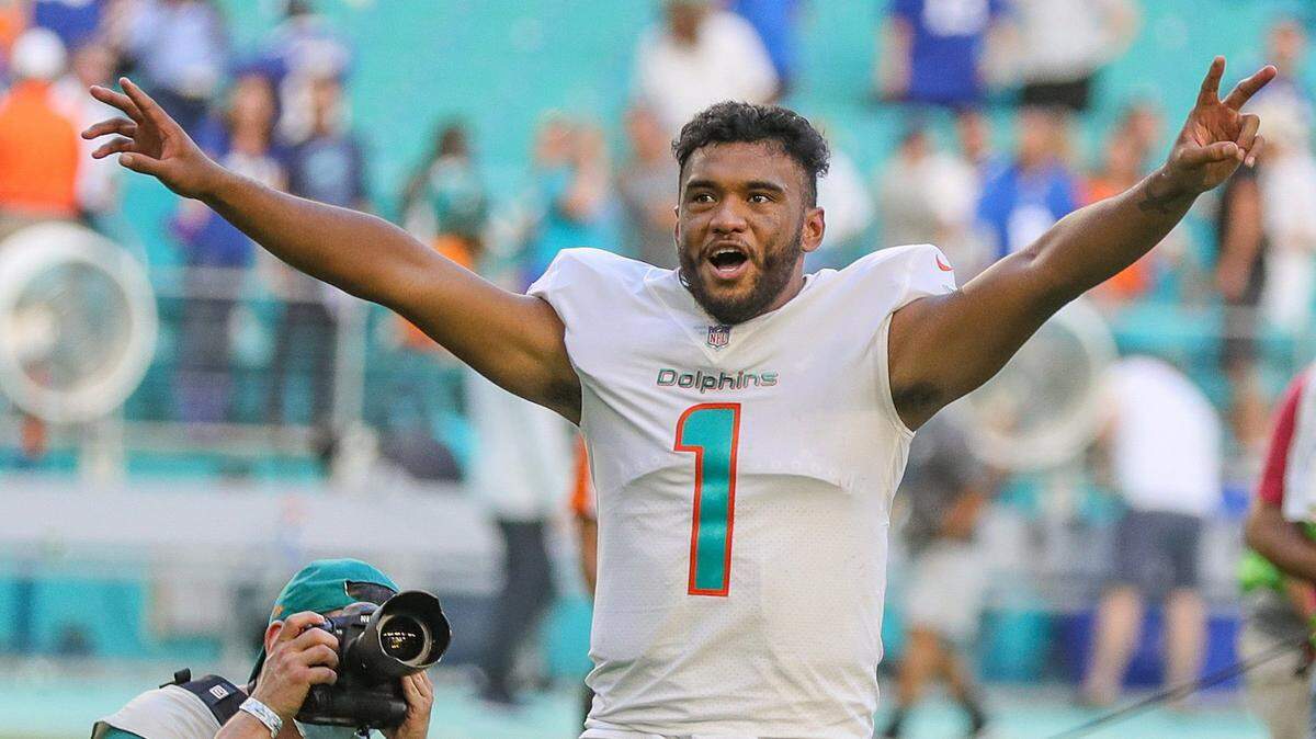Miami Dolphins quarterback Tua Tagovailoa (1) celebrates after the Dolphins defeat the New York Giants at Hard Rock Stadium in Miami Gardens on Sunday, December 05, 2021. ( Al Diaz Photo / Miami Herald )