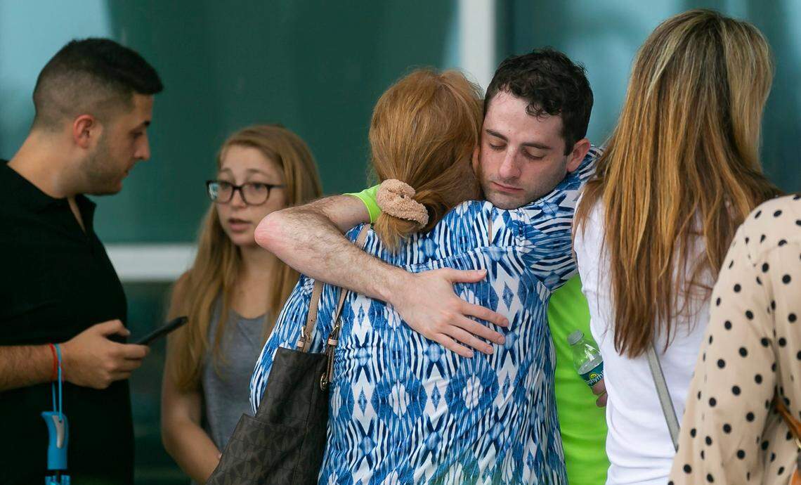 Family, residents and tourists from the Champlain Towers and nearby buildings wait for updates at a reunification center at 9301 Collins Ave. in Surfside on Thursday, June 24, 2021. A part of the Champlain Towers South Condo at 8777 Collins Ave. collapsed at 1:23 a.m. Thursday.