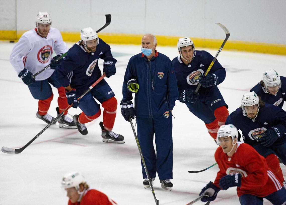 Florida Panthers players stake around Panthers head coach Joel Quenneville during the first practice of training camp in preparation for the 2020-21 NHL season at the BB&T Center on Monday, January 4, 2021 in Sunrise.