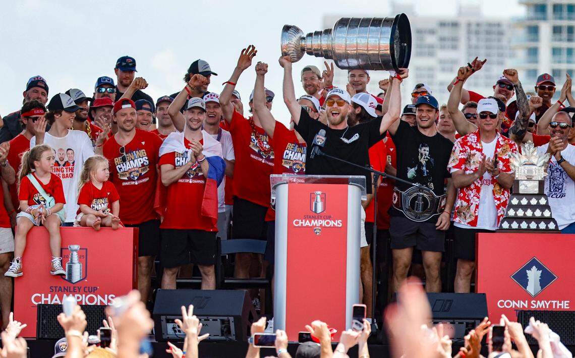 Florida Panthers center Sam Bennett (9) hoists the Stanley Cup as teammates cheer on stage during the team’s Stanley Cup victory parade and rally along A1A in Fort Lauderdale, Florida, on Sunday, June 22, 2025.